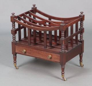 A Victorian style mahogany 4 section Canterbury, the base fitted a drawer, raised on turned supports with brass caps and casters 50cm h x 51cm w x 34cm d 