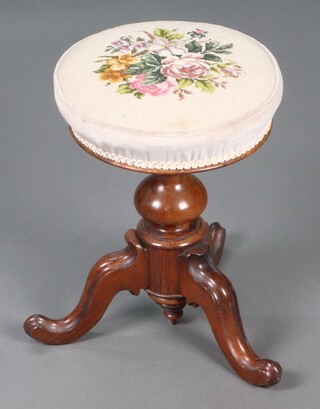 A Victorian mahogany adjustable piano stool with Berlin wool work seat, raised on turned pillar and tripod supports 47cm h x 33cm diam. 