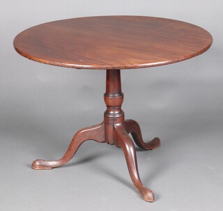 A 19th Century circular mahogany snap top tea table, raised on a turned column and tripod base 69cm h x 96cm diam. 