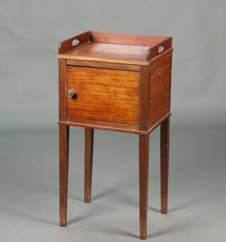 A 19th Century mahogany tray top pot cupboard with three-quarter gallery, fitted a cupboard enclosed by a panelled door, raised on square supports 85cm h x 42cm w x 34cm d 