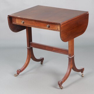 A 1920's Georgian style sofa table fitted a drawer with shaped bar stretcher, raised on standard end supports with brass caps and casters 70cm h x 68cm w x 51cm d 