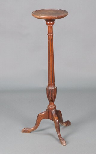 A Georgian style circular turned beech torchere, raised on a turned and fluted column with tripod base 92cm h x 25cm diam. 