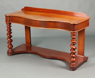 A Victorian mahogany Duchess wash stand of serpentine outline raised back, fitted a drawer, raised on spiral turned supports with undertier 79cm h x 134cm w x 54cm d 