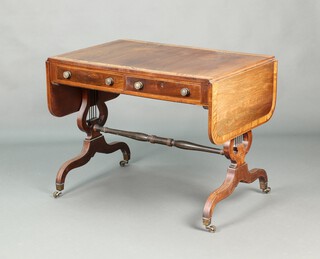 A Regency crossbanded rosewood sofa table fitted 2 frieze drawers, raised on lyre supports with turned H framed stretcher, brass caps and casters 71cm h x 92cm w x 64cm d 