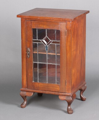 An Edwardian Art Nouveau mahogany display cabinet, fitted a shelf enclosed by a lead glazed panelled door, raised on cabriole supports 84cm h x 51cm w x 45cm d 