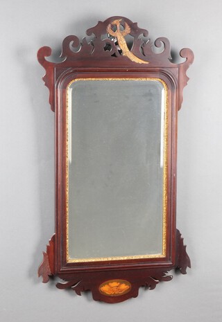 A Chippendale style arch shaped plate mirror contained in a pierced mahogany frame surmounted by a figure of a phoenix  92cm x 60cm 