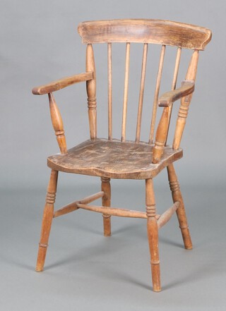 A 19th Century beech and elm Windsor stick and rail back kitchen carver chair with solid seat, raised on turned supports with H framed stretcher 91cm h x 54cm w x 39cm d 