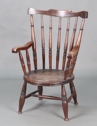 A 19th Century beech and elm stick and rail back Windsor kitchen carver chair with circular seat, raised on turned supports with H framed stretcher 91cm h x 57cm w x 46cm 