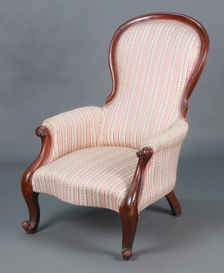 A Victorian mahogany show frame armchair, the seat of serpentine outline, upholstered in floral Regency striped material, raised on cabriole supports 90cm h x 62cm w x 58cm d 