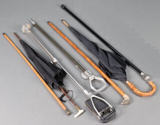 An ebonised walking cane, 2 shooting sticks, an evening cane with horn handle, walking stick, parasol and an umbrella 