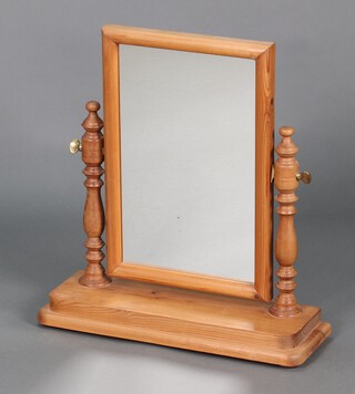 A Victorian style rectangular plate dressing table mirror contained in a pine swing frame 55cm h x 51cm w x 18cm d