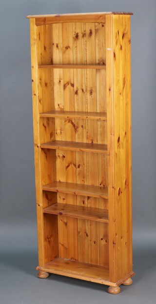 A pine 5 tier bookcase on a platform base 181h x 66w x 26d 