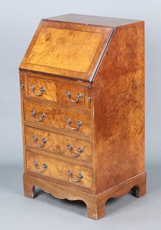 A Georgian style walnut bureau with fall front revealing a fitted interior above 4 long drawers, raised on bracket feet 98h x 52w x 43d (contact marks in places)