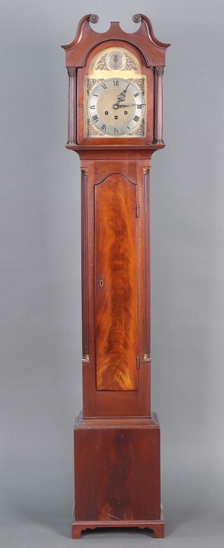 A reproduction longcase clock with 18cm arched gilt dial, silver chapter ring and Roman numerals, contained in a mahogany case with sliding hood, pendulum and key 64cm h 