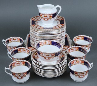 A 44 piece Royal Vale tea service comprising 3 twin handled plates (1 cracked), 21 plates (6 cracked), milk jug, sugar bowl (both cracked), 6 cups (3 cracked), 12 saucers (2 cracked) 