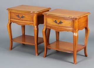 Dixie, a pair of American style cherry wood bedside cabinets, each fitted a drawer with undertier, raised on cabriole supports 62h x 55w x 42d 