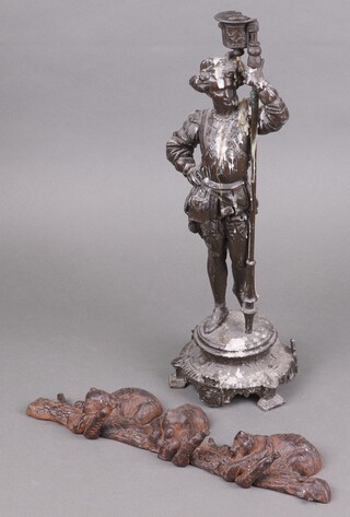 A 19th Century spelter candlestick in the form of a standing warrior (sconce f) 43cm together with a reproduction iron cast rack decorated bears 35cm