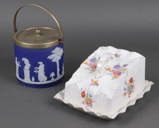 A blue Jasperware biscuit barrel and cover 12cm and a Carlton Ware wedge shaped cheese dish and cover 
