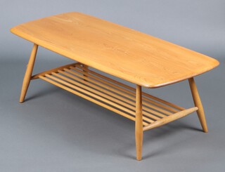 An Ercol light elm rectangular coffee table with undertier 35h x 104w x 46d (some gouge marks and contact marks in places)
