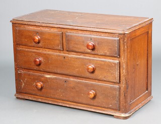 A 19th Century pine chest of 2 short and 2 long drawers with turned handles 67h x 105w x 49d (split to top, missing bun feet) 
