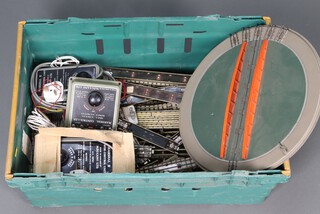 A Marshall II power control unit (x2), a Marshall controller, a turn table and various items of track, contained in a green plastic box 
