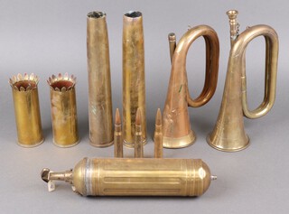 A BBIM Limited military issue brass bugle dated 1976, John Gray a copper and brass bugle (no mouth piece) and a collection of shell cases 