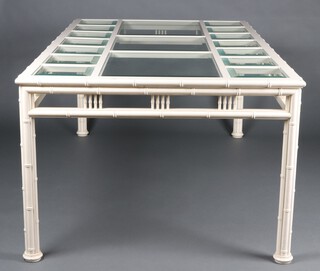 A contemporary faux bamboo dining table fitted bevelled plate glass panels 78cm h x 112cm w x 192cm 