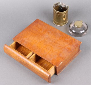 A circular cut glass inkwell 9cm, a brass measure 9cm and an oak trinket box in the form of a book 5h x 26w x 19d 