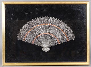 A Chinese embossed metal fan 23h x 37w, framed
