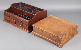 A 1930's rectangular oak box with hinged lid, the interior fitted various compartments, raised on bracket feet 10h x 32w x 27d and a rectangular mahogany desk tidy fitted compartments and 2 drawers 12h x 40w x 31d 