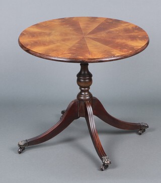A circular Georgian style mahogany occasional/wine table, raised on pillar and tripod supports 47h x 53 diam. (base f and r) 