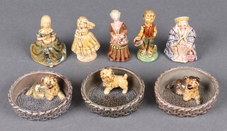 Three Wade pottery figures of dogs in baskets and 5 other Wade figures