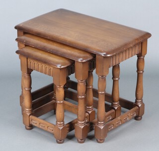 A nest of 3 Ercol style rectangular elm coffee tables on turned and block supports 47h x 61w x 38d 