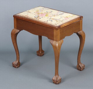 A rectangular walnut piano stool, the seat upholstered in Berlin wool work, raised on cabriole, ball and claw supports 53h x 52w x 37d 
