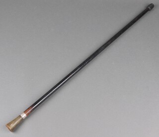An ebonised evening cane with silver band and horn handle 