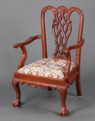 A Chippendale style mahogany open arm chair with pierced vase shaped slat back and upholstered drop in seat 95cm h x 61cm w x 45cm d 