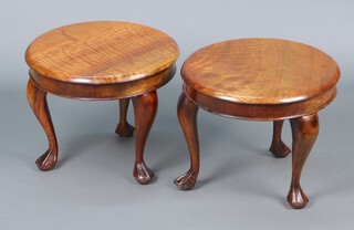 A pair of 1920's circular mahogany occasional tables, raised on cabriole, ball and claw supports 30h x 48 diam. 
