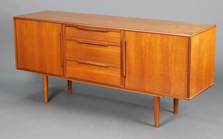 Morris of Glasgow, a mid-century teak sideboard, fitted 3 drawers to the centre flanked by cupboards 75h x 167w x 46d (water and contact marks in places)