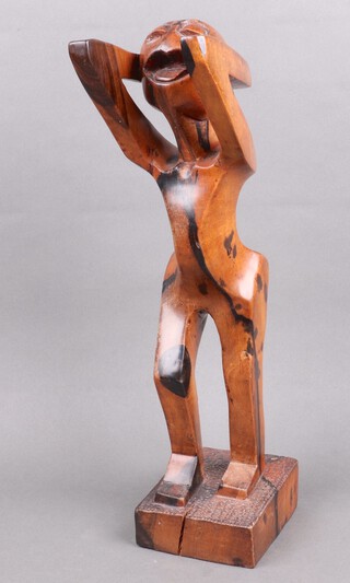 An African carved hardwood sculpture of a standing figure 47cm 