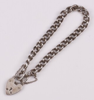 A silver curb link bracelet with padlock clasp 38cm, 23 grams 