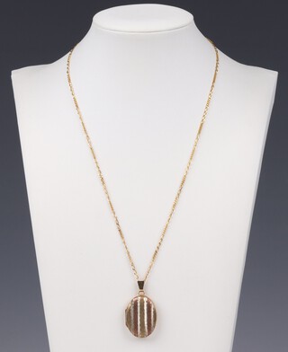 A 9ct gold chain 46cm, hung a 9ct 3 colour gold locket, 6.8 grams gross