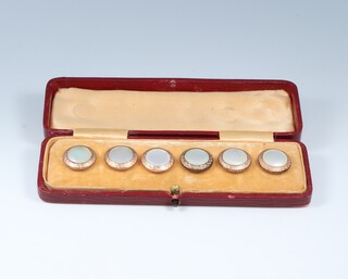 Six gilt metal dress studs 