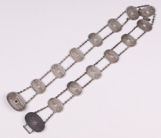 A Japanese Meiji Period silver belt made from silver 100 mon charms each with jungin (pure silver) mark, 69 cm, 112 grams  