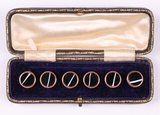 Six gilt metal and enamel dress studs, cased