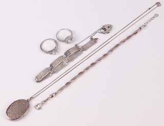 A 925 silver mesh bracelet 21cm, a pierced silver bracelet with Grecian key decoration and padlock clasp and an engraved oval silver locket hung on a fine silver, together with 2 dress rings 