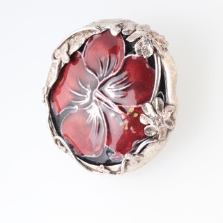 A Moorcroft hibiscus pattern silver mounted brooch 3cm 