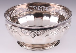A circular pierced panel silver bowl raised on a spreading foot Birmingham 1951, by Henry Atkin, 20cm, 500 grams 