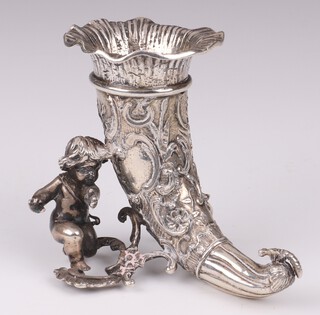 A German silver cornucopia supported by a cherub, stamped crowned R and indecipherable mark likely Friedrich Reusswig, Hanau 1903-1926, 8cm, 104 grams 