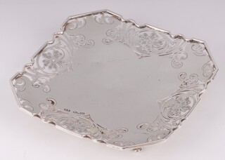 A square pierced silver dish on panelled supports Birmingham 1928, by Viners Ltd., 118 grams 