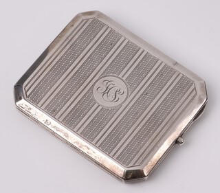 An engraved silver cigarette case with engine turned decoration, monogrammed, Birmingham 1946 by Henry Manton, 113 grams 